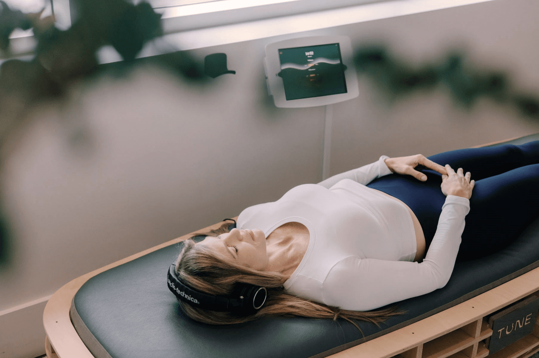Woman laying on a TUNE bed